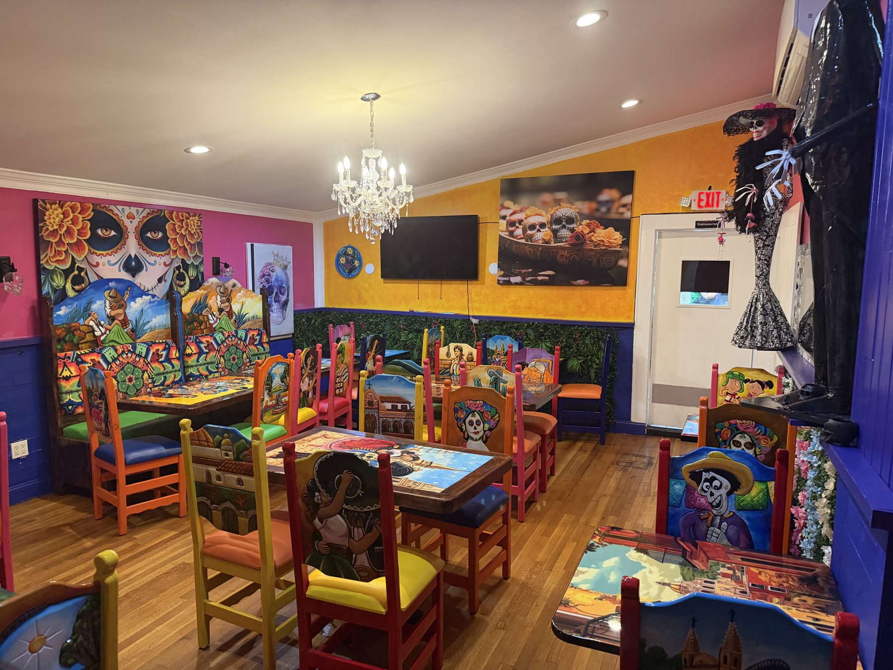 Colorful hand-painted dining room at La Catrina
